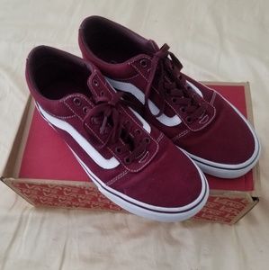 Dark red Vans shoes.